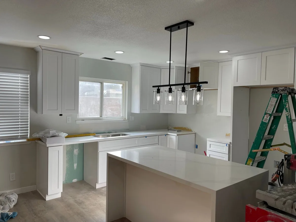 White kitchen cabinets painted during a remodel