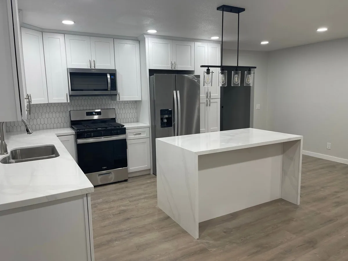 White painted kitchen cabinets with a quartz island in San Bernardino